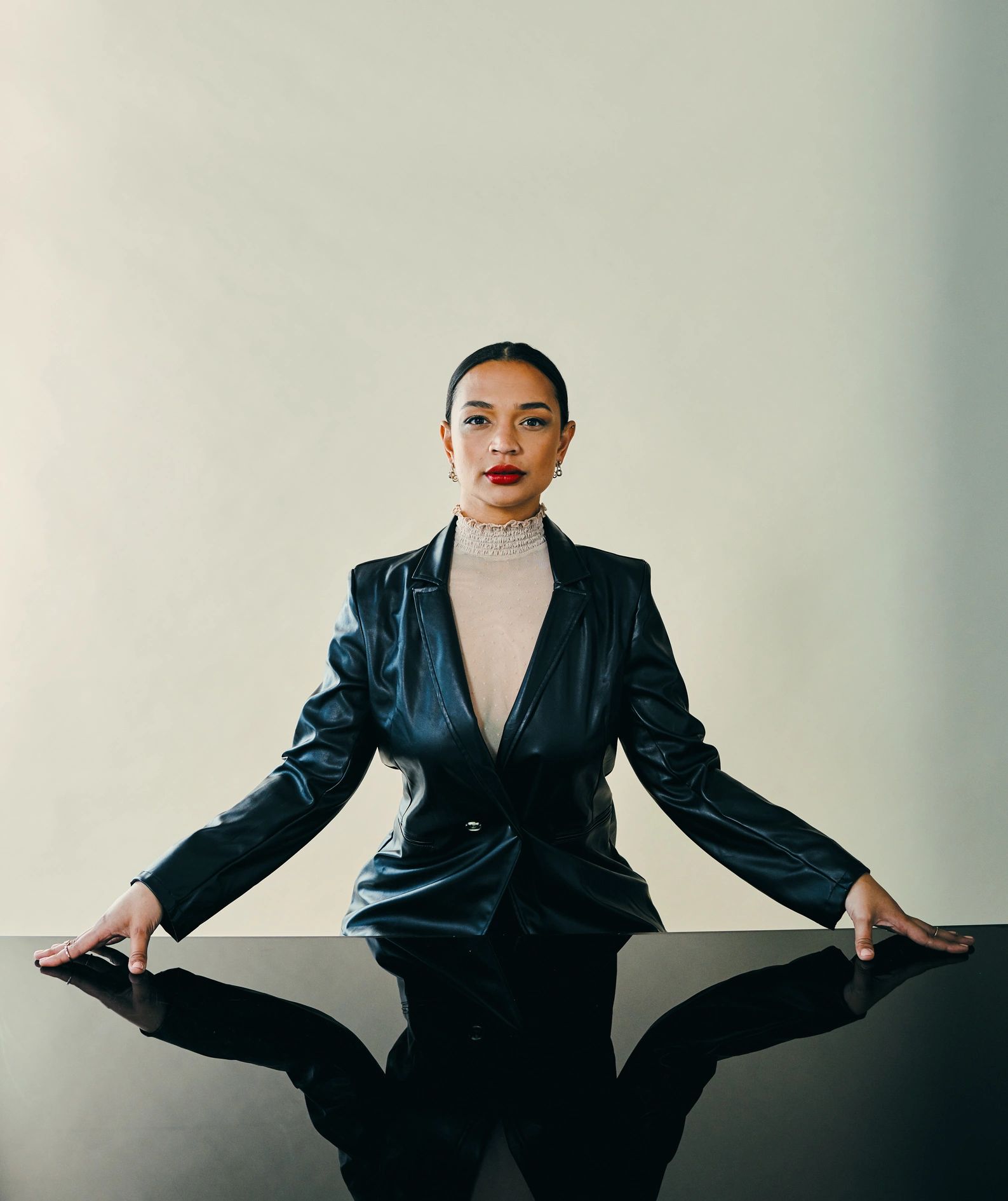 Studio portrait of a young woman in an editorial setting
