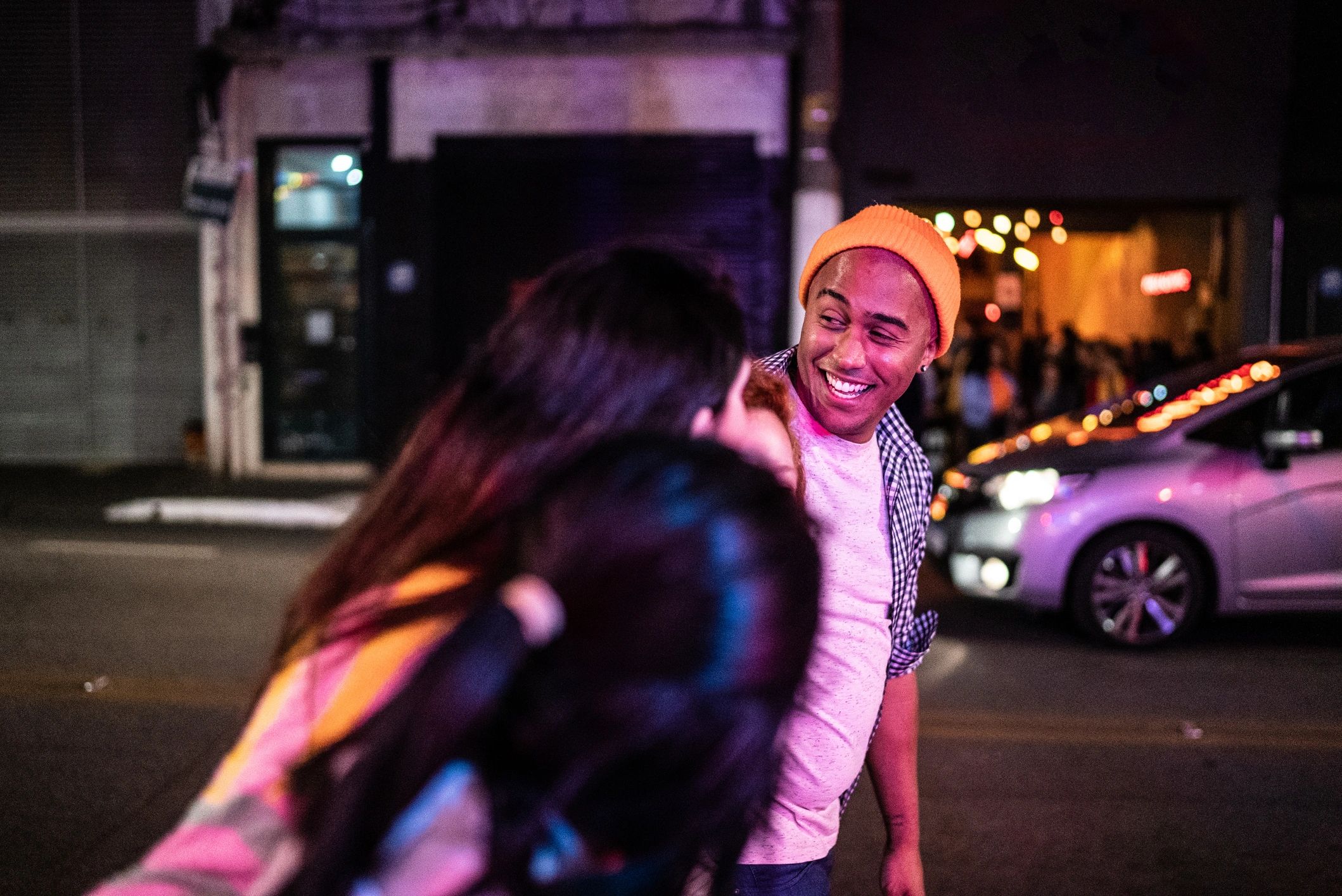 Young creatives walking through the city at night